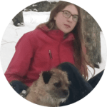 Iona Kellas in the snow with her little dog