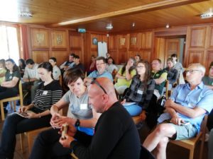 Participants listen to the presentations